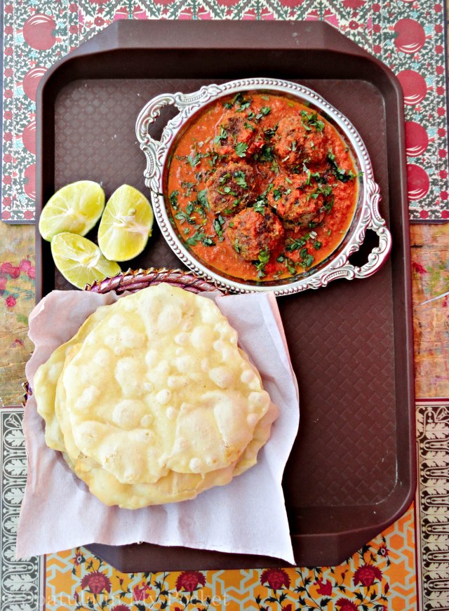 Soft, succulent kebabs smothered in a rich spicy tomato gravy.