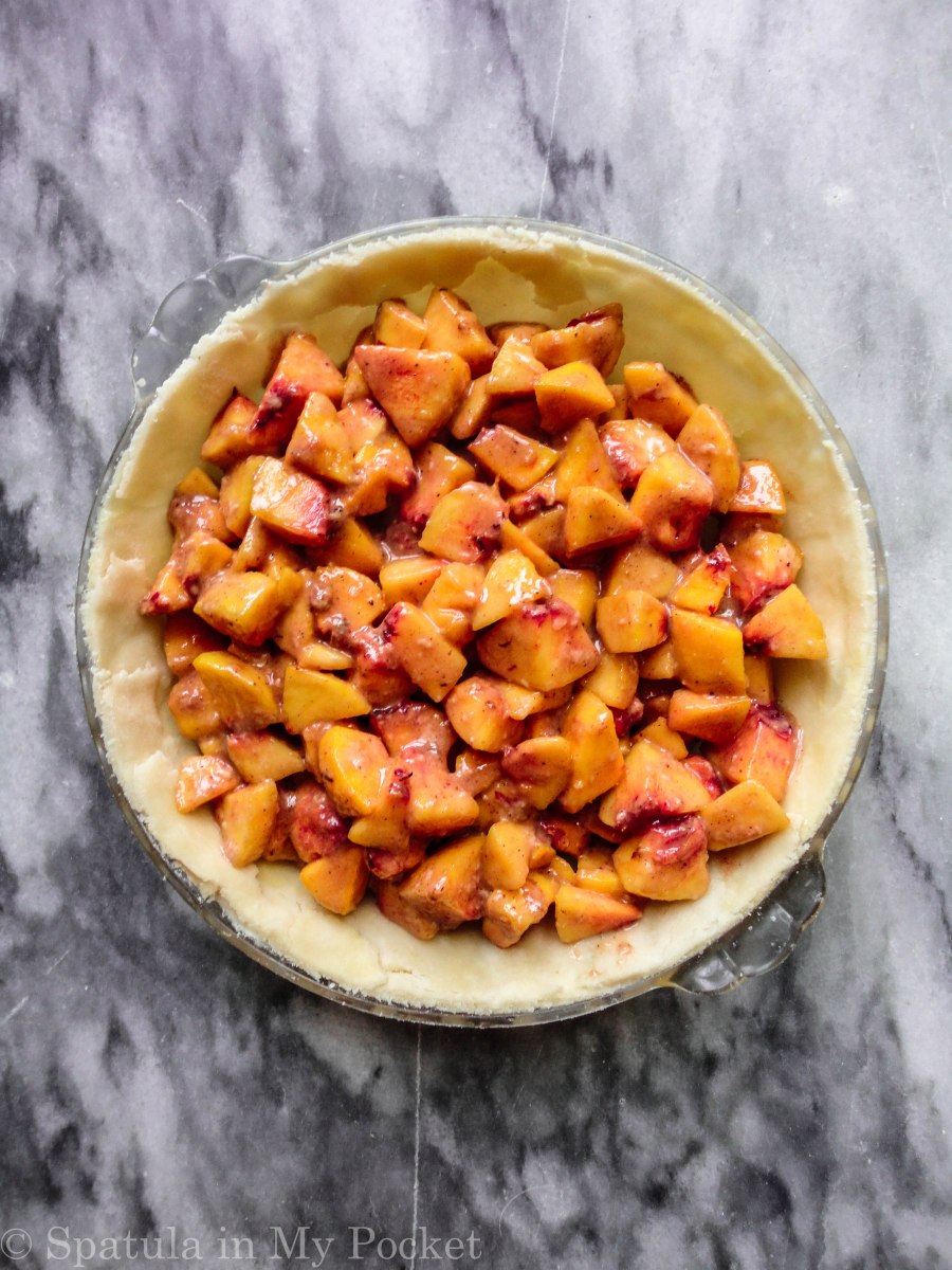 Peach Crumble Pie. A flaky crust filled with juicy peaches and topped with a walnut cinnamon crumble. It’s sweet. It’s juicy. It’s delicious.