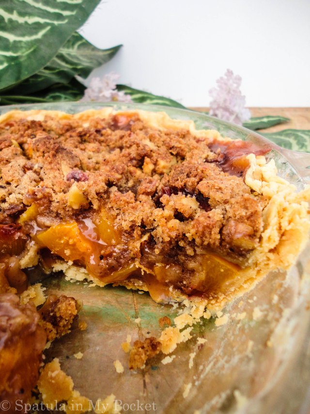Peach Crumble Pie. A flaky crust filled with juicy peaches and topped with a walnut cinnamon crumble. It’s sweet. It’s juicy. It’s delicious.