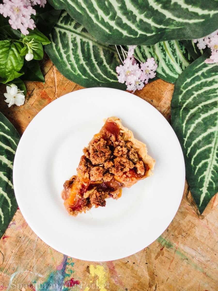 Peach Crumble Pie. A flaky crust filled with juicy peaches and topped with a walnut cinnamon crumble. It’s sweet. It’s juicy. It’s delicious.