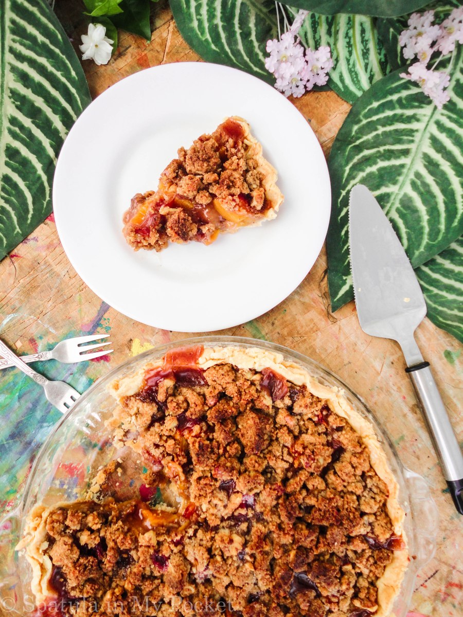 Peach Crumble Pie. A flaky crust filled with juicy peaches and topped with a walnut cinnamon crumble. It’s sweet. It’s juicy. It’s delicious.