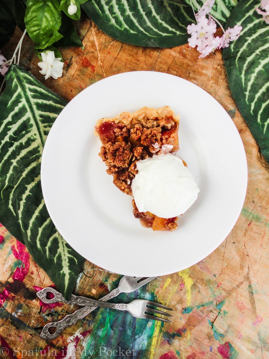 Peach Crumble Pie. A flaky crust filled with juicy peaches and topped with a walnut cinnamon crumble. It’s sweet. It’s juicy. It’s delicious.