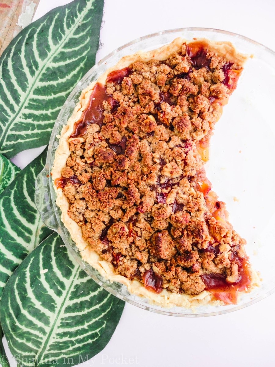 Peach Crumble Pie. A flaky crust filled with juicy peaches and topped with a walnut cinnamon crumble. It’s sweet. It’s juicy. It’s delicious.