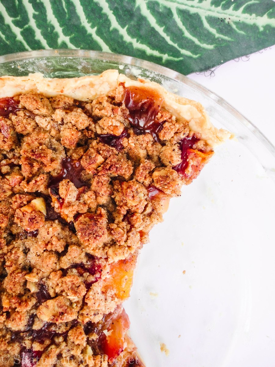 Peach Crumble Pie. A flaky crust filled with juicy peaches and topped with a walnut cinnamon crumble. It’s sweet. It’s juicy. It’s delicious.