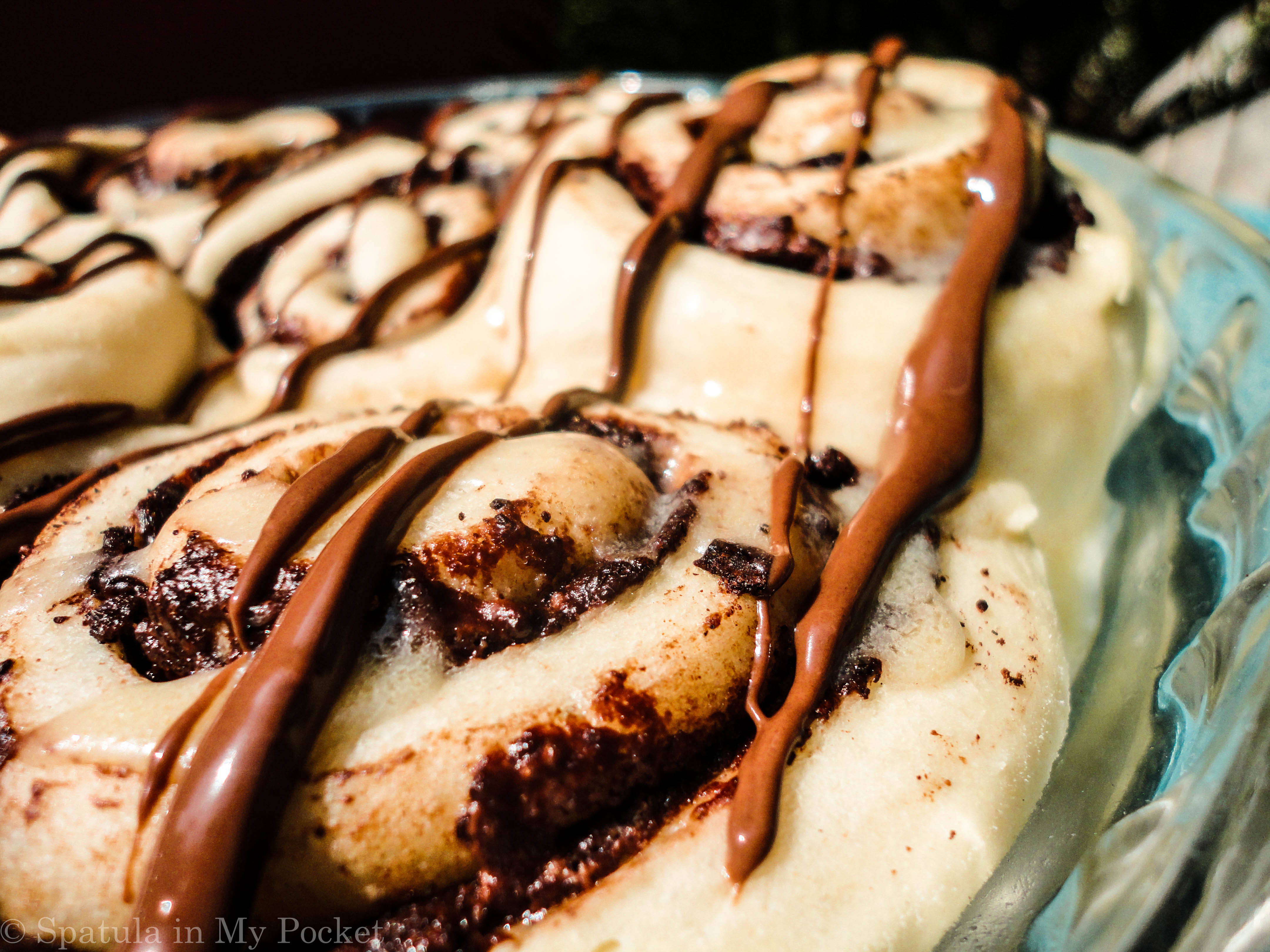 This light fluffy dough, is filled with Nutella and butter and cinnamon, then baked until gooey and brown, and topped with drizzles upon drizzles of cream cheese glaze and more molten Nutella. 