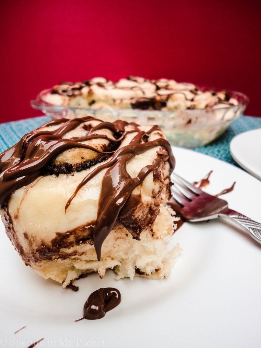 This light fluffy dough, is filled with Nutella and butter and cinnamon, then baked until gooey and brown, and topped with drizzles upon drizzles of cream cheese glaze and more molten Nutella.