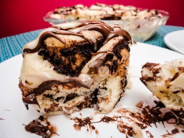 This light fluffy dough, is filled with Nutella and butter and cinnamon, then baked until gooey and brown, and topped with drizzles upon drizzles of cream cheese glaze and more molten Nutella.