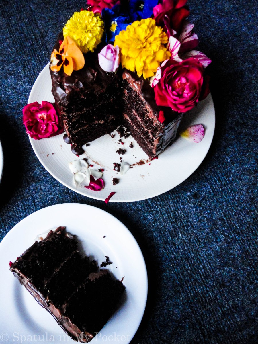 3 layers of rich moist chocolate cake, sandwiched with a dreamy creamy chocolate fudge frosting, and topped with drizzles of smooth lush chocolate ganache.