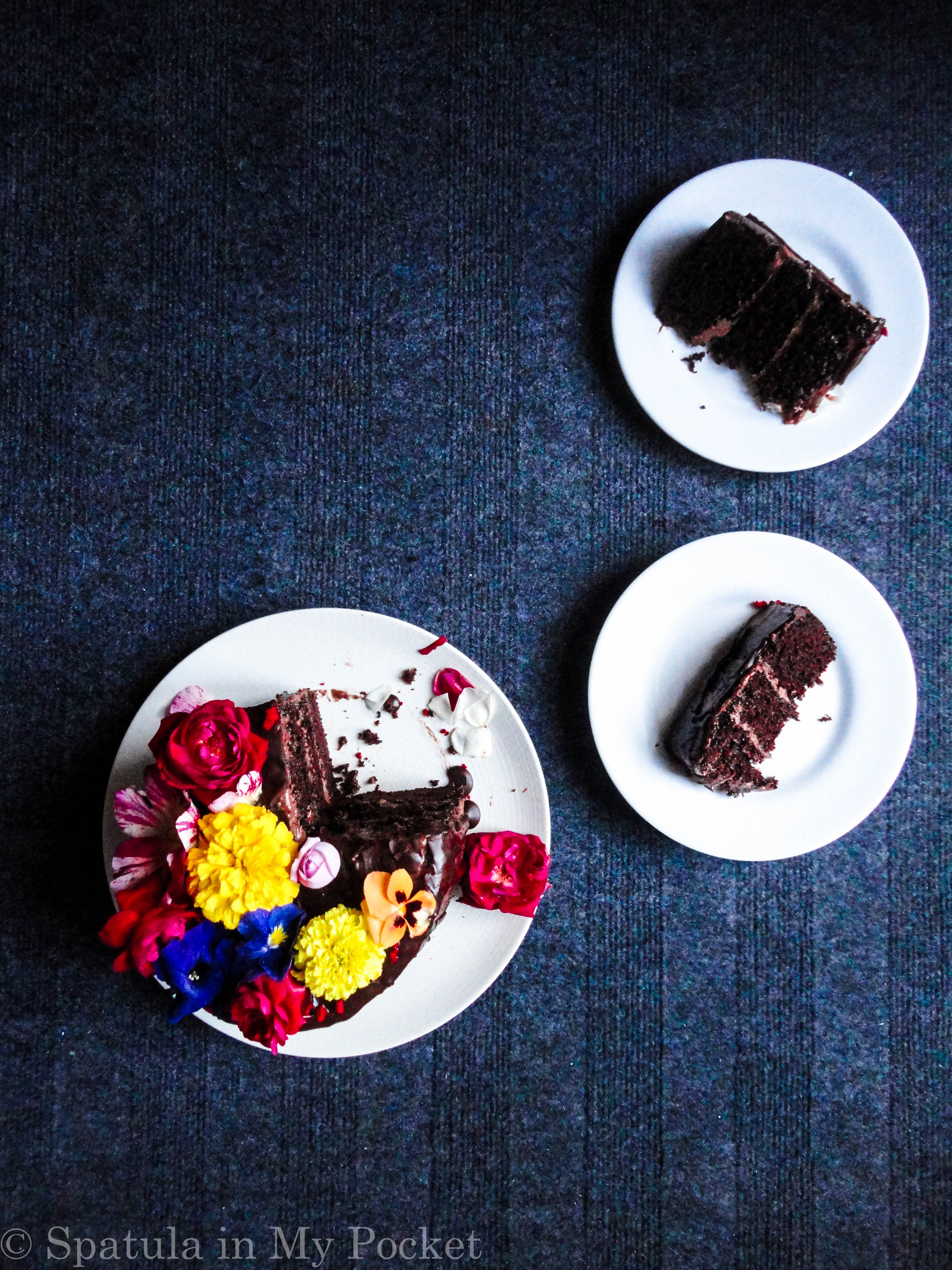 3 layers of rich moist chocolate cake, sandwiched with a dreamy creamy chocolate fudge frosting, and topped with drizzles of smooth lush chocolate ganache.