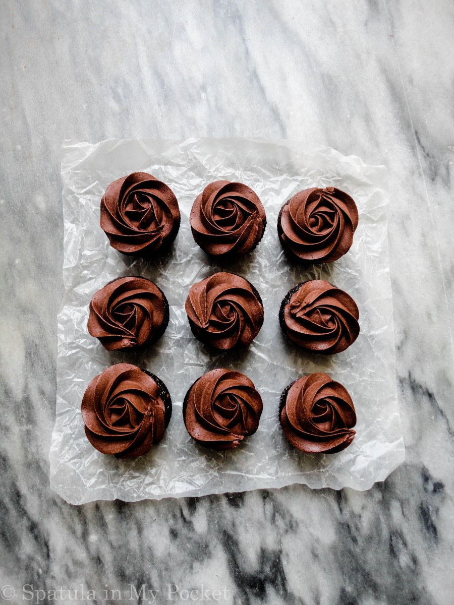 Moist chocolate cupcakes topped with a fudgy chocolate frosting