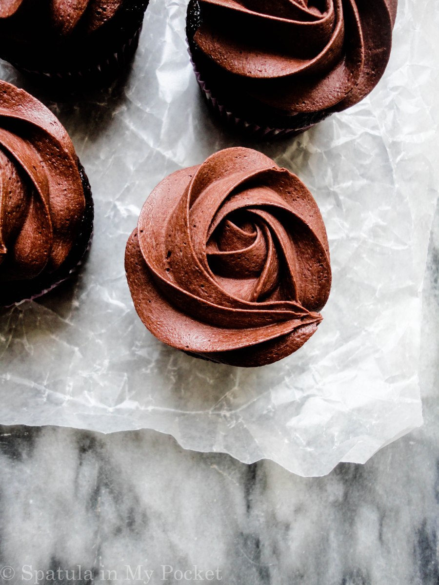 Moist chocolate cupcakes topped with a fudgy chocolate frosting