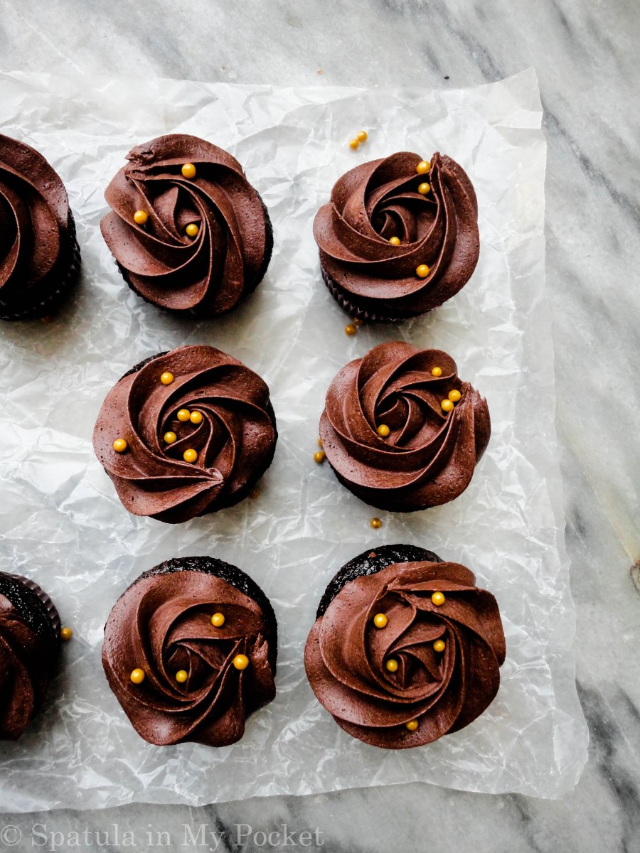 Moist chocolate cupcakes topped with a fudgy chocolate frosting