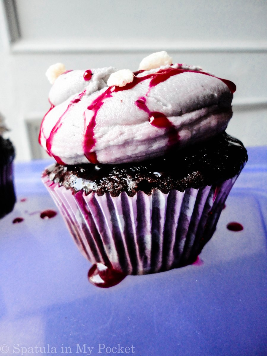 Bloody cupcakes with maggots and gashes.