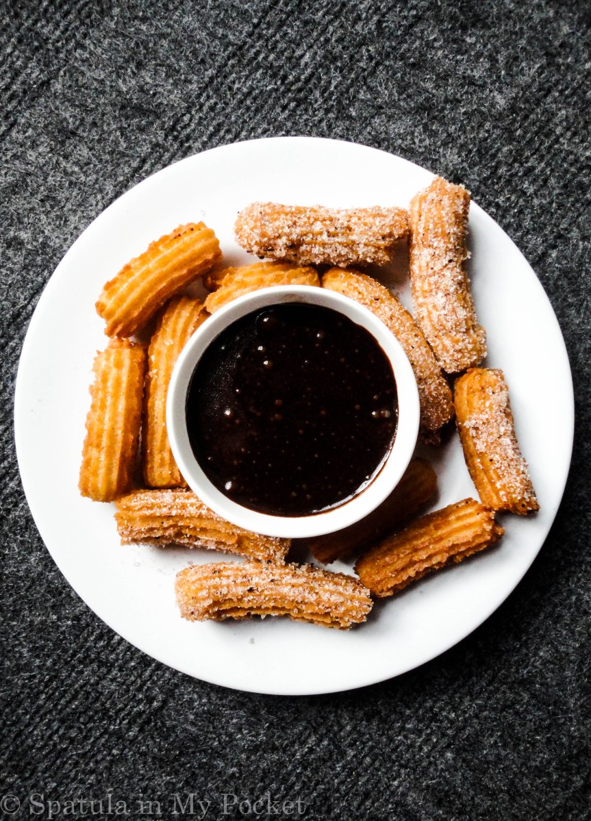 Crispy, golden churros rolled in cinnamon and sugar and dunked in a dark chocolate sauce #churros