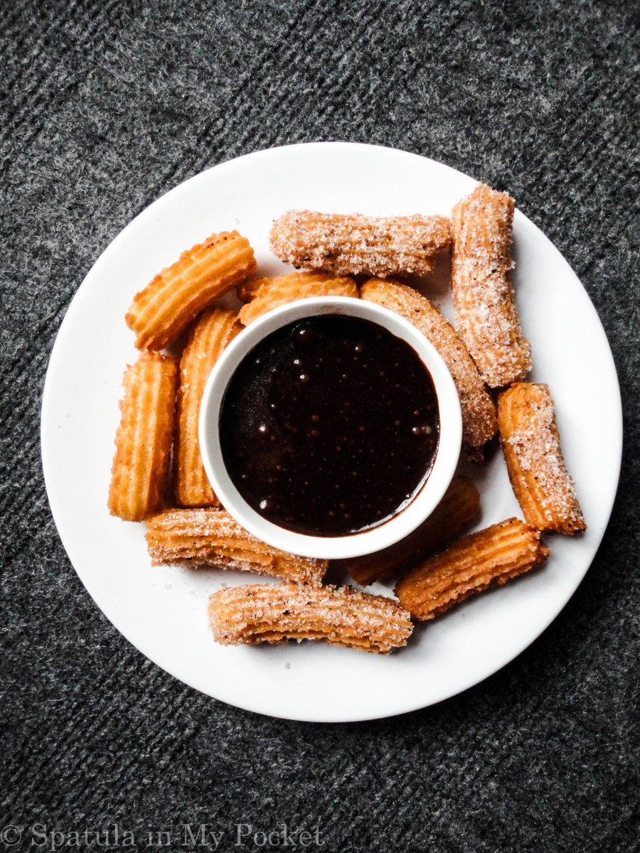 Crispy, golden churros rolled in cinnamon and sugar and dunked in a dark chocolate sauce #churros