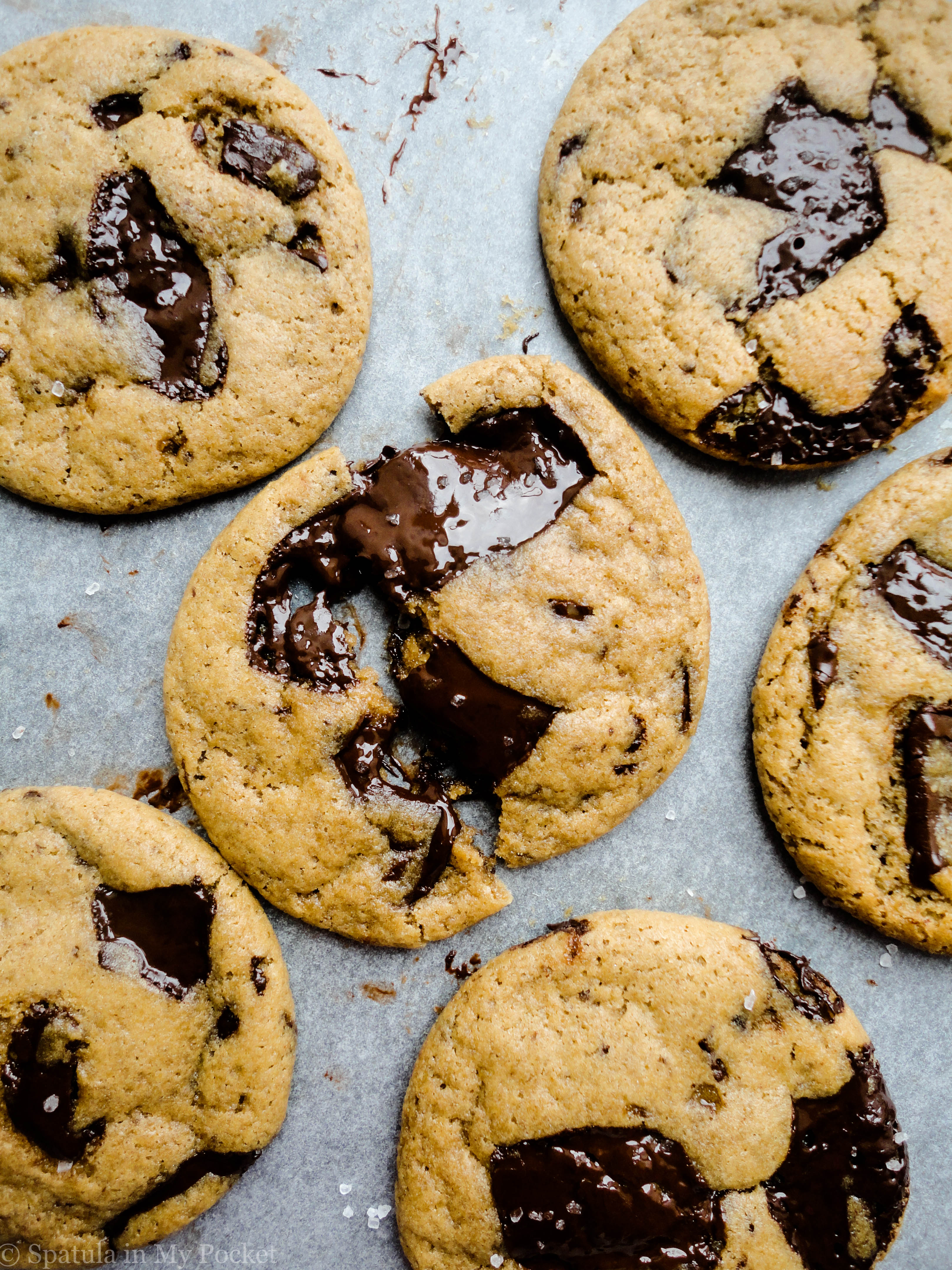 Chocolate chip cookies packed with dark chocolate which melt into the most gorgeous glistening pools of molten chocolate. #chocolate #cookies #recipe